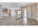Large living room featuring recessed lighting, gray wood flooring and access to outdoor space at 7119 Falabella Ridge Ave, Las Vegas, NV 89131