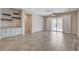 Spacious living room featuring a wet bar and sliding doors to the backyard at 7119 Falabella Ridge Ave, Las Vegas, NV 89131