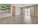 Spacious living room featuring a wet bar and sliding doors to the backyard at 7119 Falabella Ridge Ave, Las Vegas, NV 89131