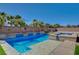 A backyard pool with a spa and baja step entry at 7119 Falabella Ridge Ave, Las Vegas, NV 89131
