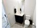 Cozy powder room featuring a modern vanity, toilet, and sleek mirror at 760 Crisp Morning Ct, North Las Vegas, NV 89086