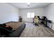Bedroom with carpet, window, and desk at 760 Crisp Morning Ct, North Las Vegas, NV 89086