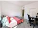 Well-lit bedroom with a cozy bed, modern desk setup, and neutral color palette at 760 Crisp Morning Ct, North Las Vegas, NV 89086