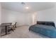 Spacious bedroom featuring carpet, a bed, and a desk with a modern chair at 760 Crisp Morning Ct, North Las Vegas, NV 89086