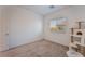 This comfortable bedroom features neutral carpeting and a window with backyard views at 760 Crisp Morning Ct, North Las Vegas, NV 89086