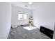 Bright bedroom featuring ample natural light, a cat tree, and comfortable pet amenities at 760 Crisp Morning Ct, North Las Vegas, NV 89086