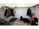 Walk in closet with carpet, hanging storage, and a variety of clothing items at 760 Crisp Morning Ct, North Las Vegas, NV 89086