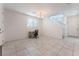 Bright and spacious foyer area with tiled floors, a staircase, and natural light at 760 Crisp Morning Ct, North Las Vegas, NV 89086