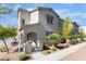 Attractive townhome featuring neutral stucco, covered entryway and low water landscaping at 760 Crisp Morning Ct, North Las Vegas, NV 89086