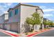 View of the side of a two-story home with street parking and clean landscaping at 760 Crisp Morning Ct, North Las Vegas, NV 89086