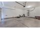 Large garage space with equipment; ready for storage or as a workshop area at 760 Crisp Morning Ct, North Las Vegas, NV 89086