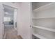 Hallway view of desk and chair area from hall including a built in linen closet at 760 Crisp Morning Ct, North Las Vegas, NV 89086