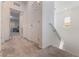 Upstairs hallway with neutral carpet, white walls and access to other rooms at 760 Crisp Morning Ct, North Las Vegas, NV 89086