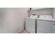 This bright laundry room includes a modern washer and dryer for convenience at 760 Crisp Morning Ct, North Las Vegas, NV 89086