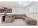 Open concept living area with tile floors, and a modern kitchen visible in the background at 760 Crisp Morning Ct, North Las Vegas, NV 89086
