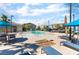 Community pool area showcasing lounge chairs and umbrellas for relaxed outdoor enjoyment at 760 Crisp Morning Ct, North Las Vegas, NV 89086