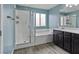 Bathroom features a separate shower and tub, with wood tile flooring at 9316 Golden Lad Ave, Las Vegas, NV 89166