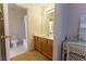 Well-lit bathroom featuring a vanity and a shower-tub combo, perfect for relaxation at 9935 Swimming Hole St, Las Vegas, NV 89183