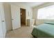 Bright bedroom with natural light, a closet, and neutral walls, conveniently located near the stairway at 9935 Swimming Hole St, Las Vegas, NV 89183