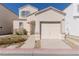 View of front exterior showcasing neutral paint, one car garage and desert landscaping at 9935 Swimming Hole St, Las Vegas, NV 89183