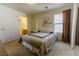 Comfortable main bedroom featuring a large window and a view to the ensuite bath at 9935 Swimming Hole St, Las Vegas, NV 89183