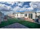 Spacious backyard featuring artificial turf, a hammock and a paved patio, ideal for outdoor living at 10009 Locking Biner Ave, Las Vegas, NV 89166