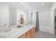 Bathroom featuring double sinks, white countertops, and a shower-tub combination at 10009 Locking Biner Ave, Las Vegas, NV 89166