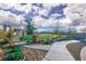 Beautiful community park features walking paths, benches, mature trees, and grassy areas at 10009 Locking Biner Ave, Las Vegas, NV 89166