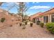 A beautiful private backyard with mature landscaping and gravel ground cover for low maintenance at 10041 Arbuckle Dr, Las Vegas, NV 89134