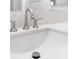 Close-up of elegant bathroom sink with brushed nickel faucet and a white countertop at 10041 Arbuckle Dr, Las Vegas, NV 89134