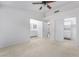 Bedroom with neutral carpet featuring ensuite access, closet and ceiling fan at 10041 Arbuckle Dr, Las Vegas, NV 89134