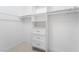 Walk-in closet with custom shelving and storage drawers at 10041 Arbuckle Dr, Las Vegas, NV 89134