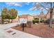 Single-story home with a two car garage featuring desert landscaping, gravel ground cover and driveway at 10041 Arbuckle Dr, Las Vegas, NV 89134