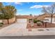 Charming single-story home with a well-manicured front yard and a two-car garage at 10041 Arbuckle Dr, Las Vegas, NV 89134