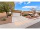 Attractive single-story house with a well-maintained front yard and spacious driveway at 10041 Arbuckle Dr, Las Vegas, NV 89134