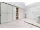 Spacious garage with built-in cabinets along the walls and ample room for vehicles at 10041 Arbuckle Dr, Las Vegas, NV 89134