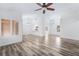 Bright and airy living room featuring recessed lighting and wood-look floors throughout at 10041 Arbuckle Dr, Las Vegas, NV 89134
