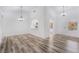 Bright, open-concept living room with modern flooring and plenty of natural light at 10041 Arbuckle Dr, Las Vegas, NV 89134