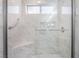 Walk-in shower with glass surround, bench seat and updated shower head at 10041 Arbuckle Dr, Las Vegas, NV 89134