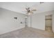 Bedroom with a ceiling fan, closet, carpeted floor and multiple entryways at 10265 Franford Ct, Las Vegas, NV 89183