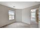Bright bedroom with carpet, a window with blinds, and an open doorway at 10265 Franford Ct, Las Vegas, NV 89183