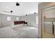 Open loft area with carpeted flooring, recessed lighting, and a laundry room at 10265 Franford Ct, Las Vegas, NV 89183