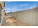 Cozy private patio with gravel landscaping and block wall fence, perfect for outdoor relaxation at 10265 Franford Ct, Las Vegas, NV 89183