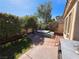 Private backyard featuring a well maintained lawn, hot tub, mature plants, and privacy from neighbors at 10705 Arundel Ave, Las Vegas, NV 89135