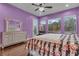 Bedroom featuring natural lighting, an exterior door, and relaxing garden views at 10705 Arundel Ave, Las Vegas, NV 89135