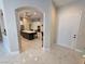 Bright foyer with marble floors leads to an open-concept kitchen with stainless steel appliances at 10705 Arundel Ave, Las Vegas, NV 89135