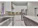 Kitchen featuring stainless steel appliances, a center island, and a stainless steel sink at 10705 Arundel Ave, Las Vegas, NV 89135