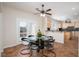 Cozy breakfast nook with glass table, view to the yard, and easy access to the kitchen at 12 Cascade Lake St, Las Vegas, NV 89148