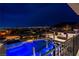 Aerial nighttime view showcasing the luxury pool and outdoor kitchen with a stunning city backdrop at 12 Olympia Chase Dr, Las Vegas, NV 89141