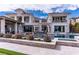 Expansive backyard featuring a luxurious pool, desert landscaping, and a covered patio for outdoor entertaining at 12 Olympia Chase Dr, Las Vegas, NV 89141